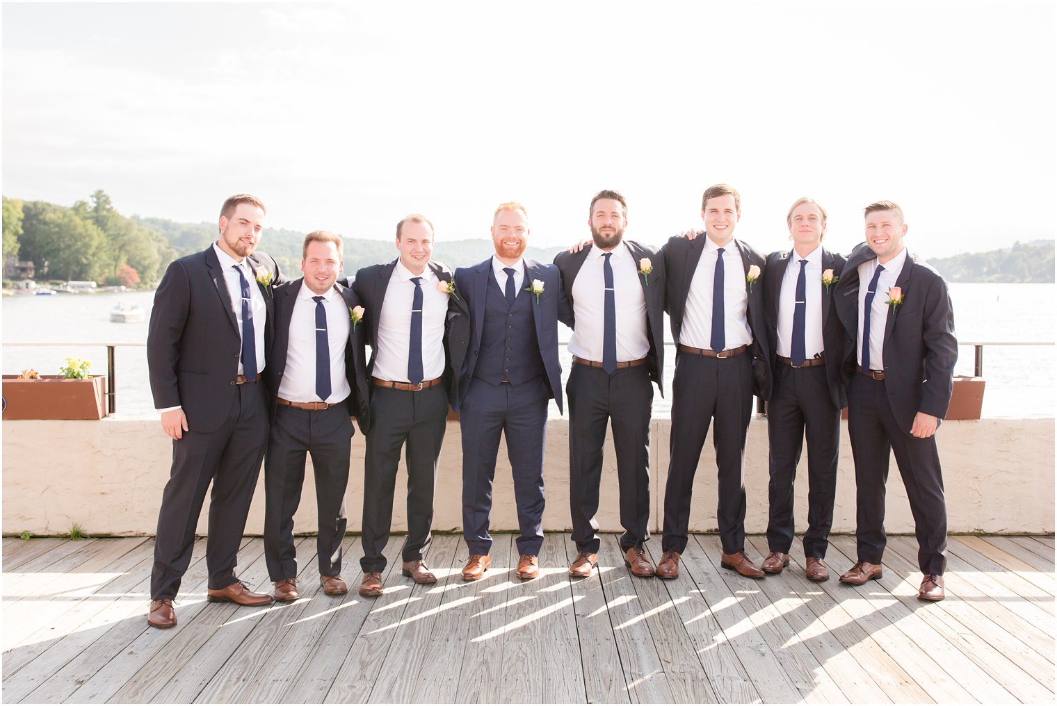 navy suits for groomsmen photographed on pier in Sparta NJ by Idalia Photography