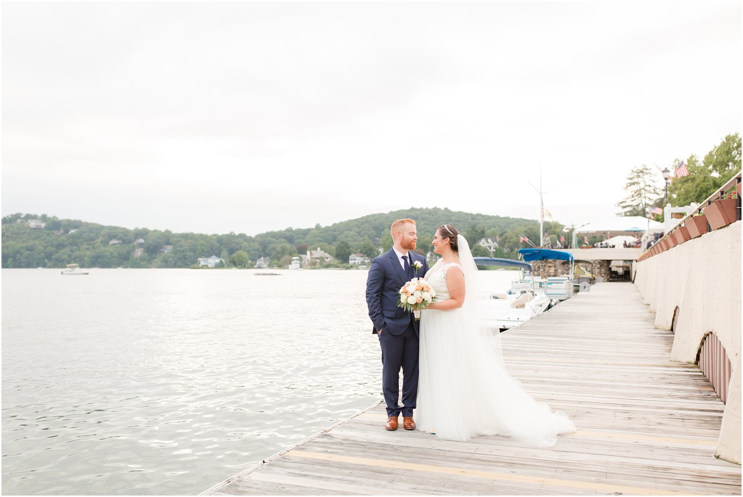 bride and groom portraits on pier at Lake Mohawk Country Club by Idalia Photography