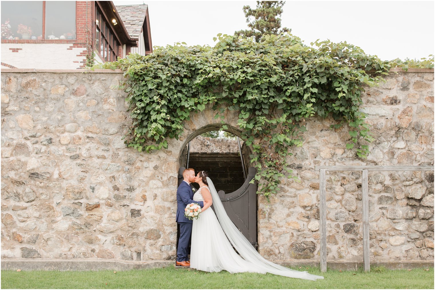 wedding portraits at Lake Mohawk Country Club show off bride's veil by Idalia Photography