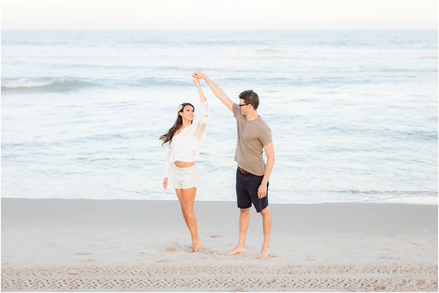 bride and groom dance during LBI engagement session with Idalia Photography