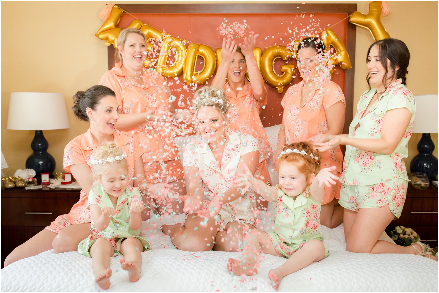 bridal party throwing confetti before Legacy Castle wedding photographed by Idalia Photography