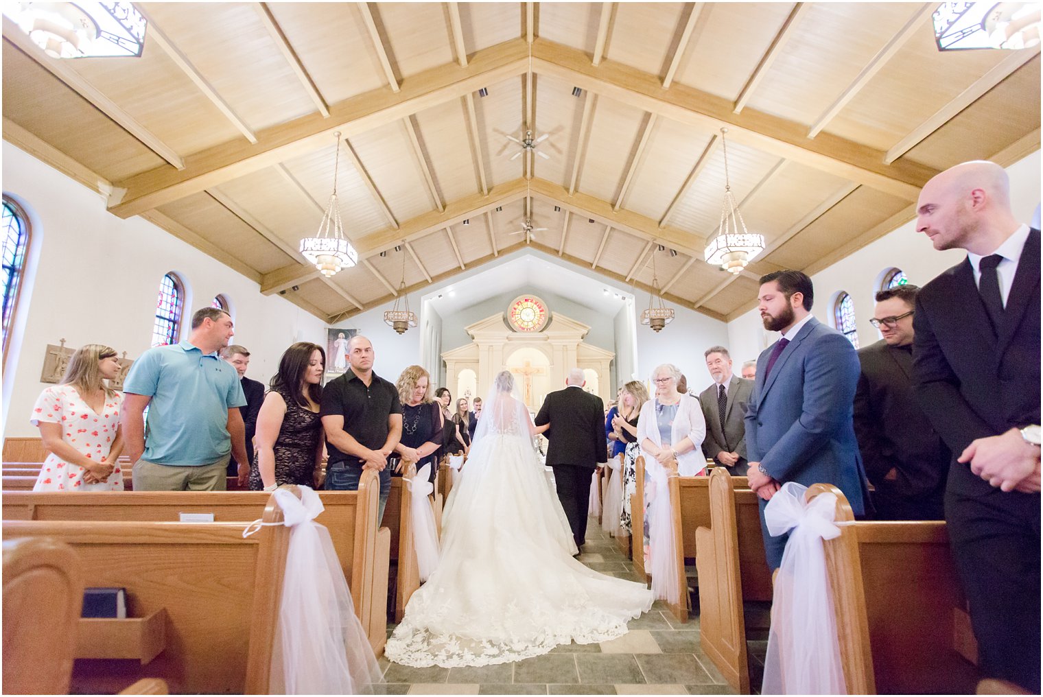 Idalia Photography captures bride going down the aisle at Saint Francis of Assisi 