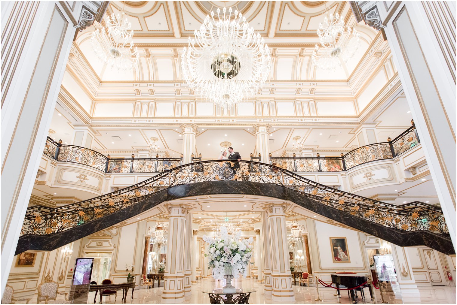 grand staircase in North Jersey wedding venue Legacy Castle by Idalia Photography