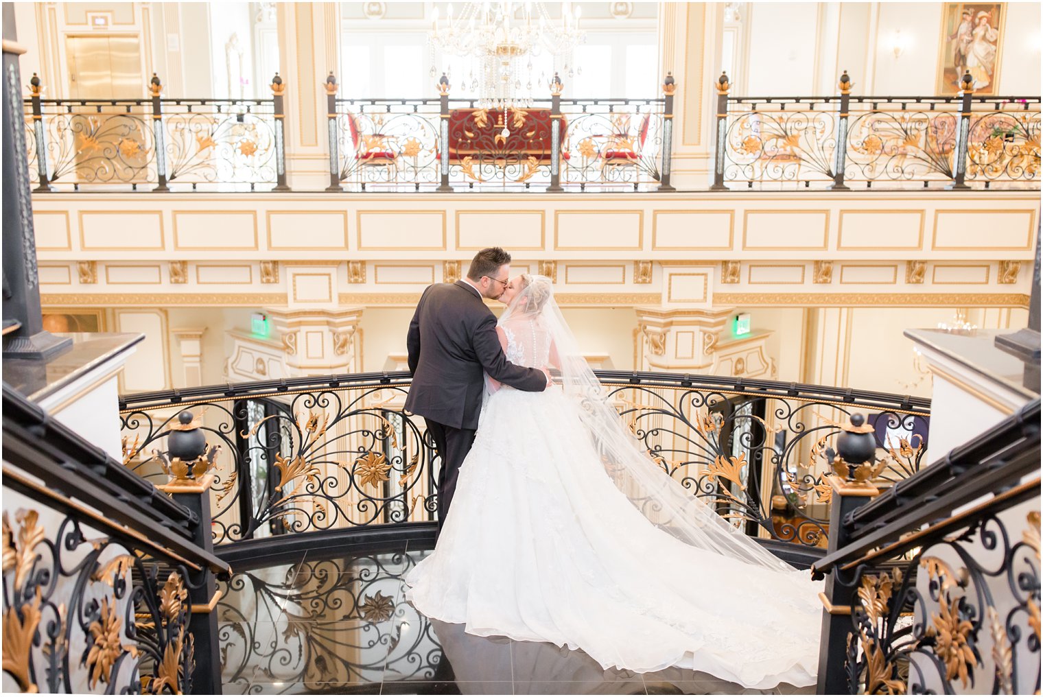 bride and groom kiss during portraits in Legacy Castle with Idalia Photography