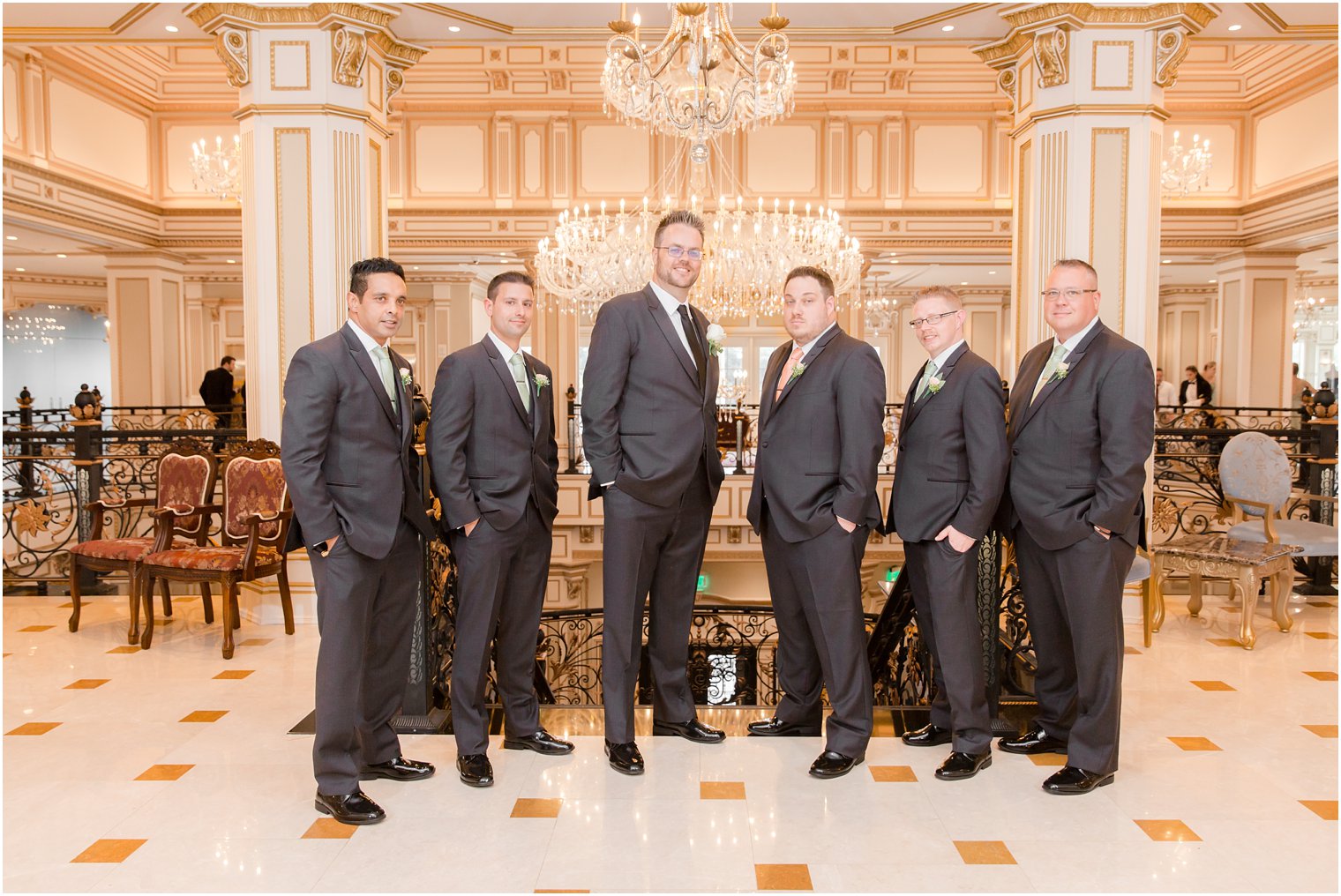 groomsmen during wedding portraits in Legacy Castle by Idalia Photography