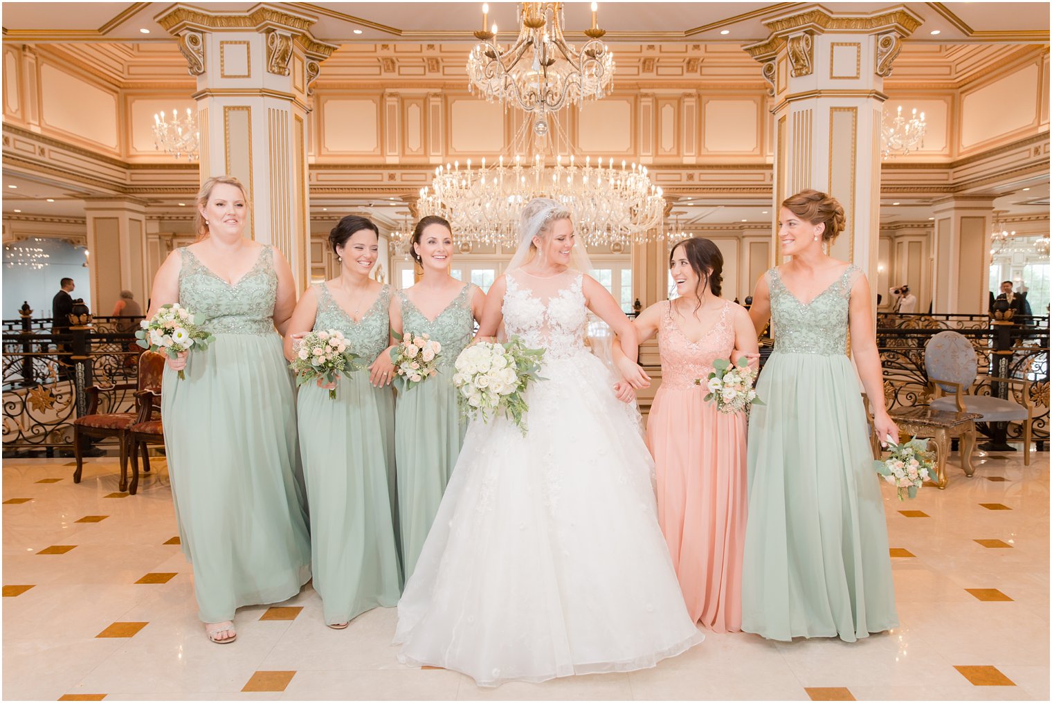 bridesmaids laugh with bride during wedding portraits in Legacy Castle with Idalia Photography