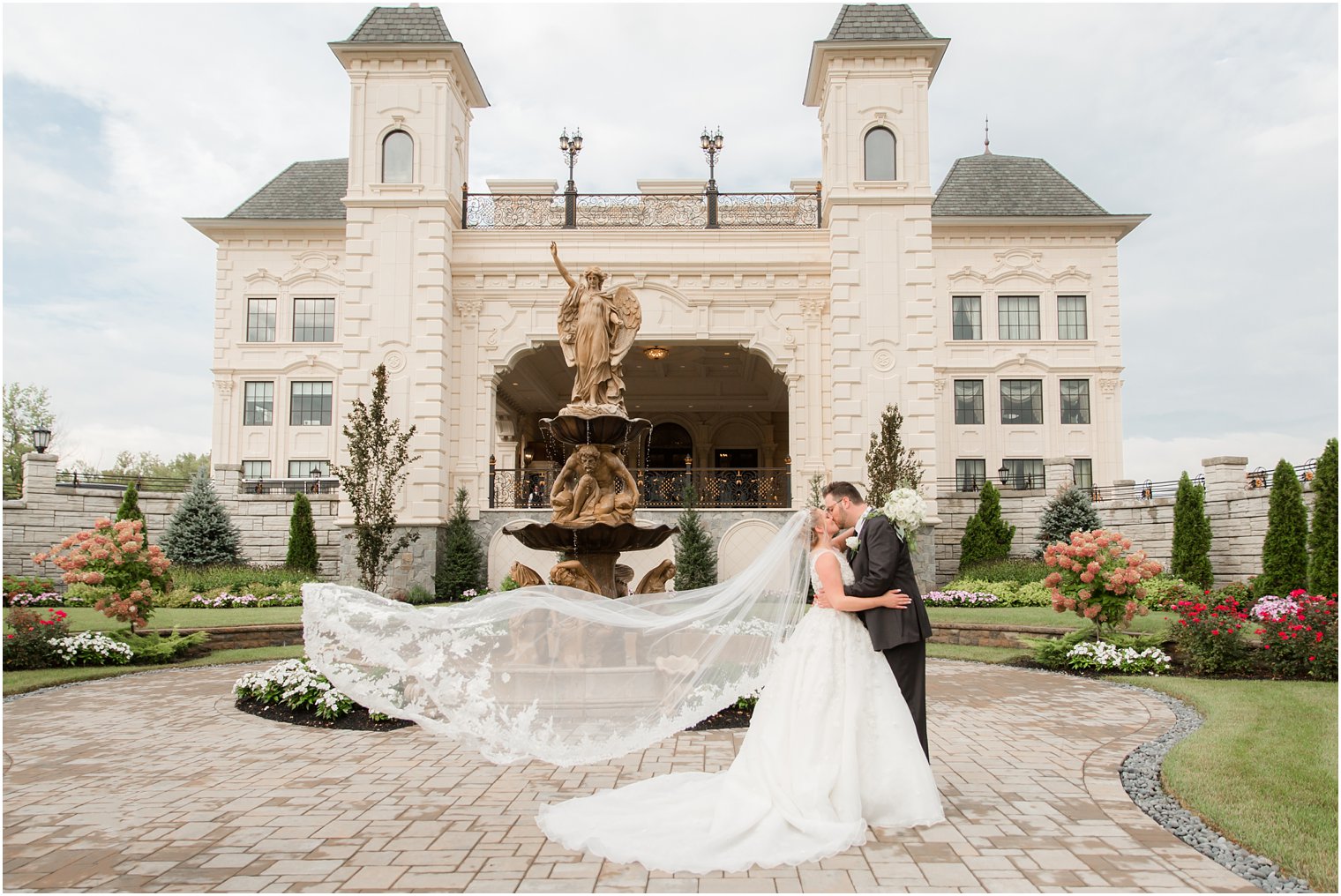 bride's veil flows during portraits at Legacy Castle with Idalia Photography