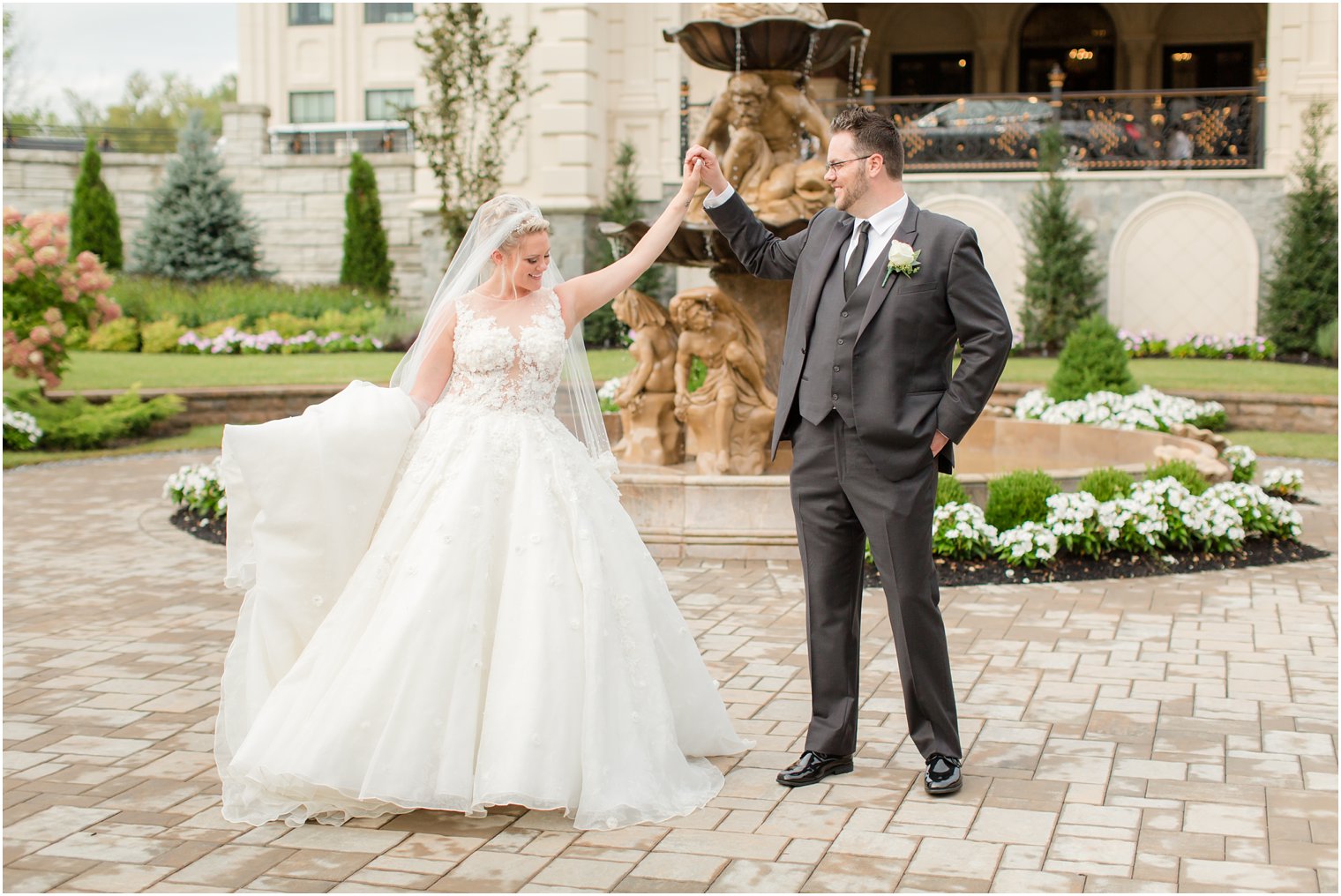 bride and groom dance during portraits at Legacy Castle by Idalia Photography