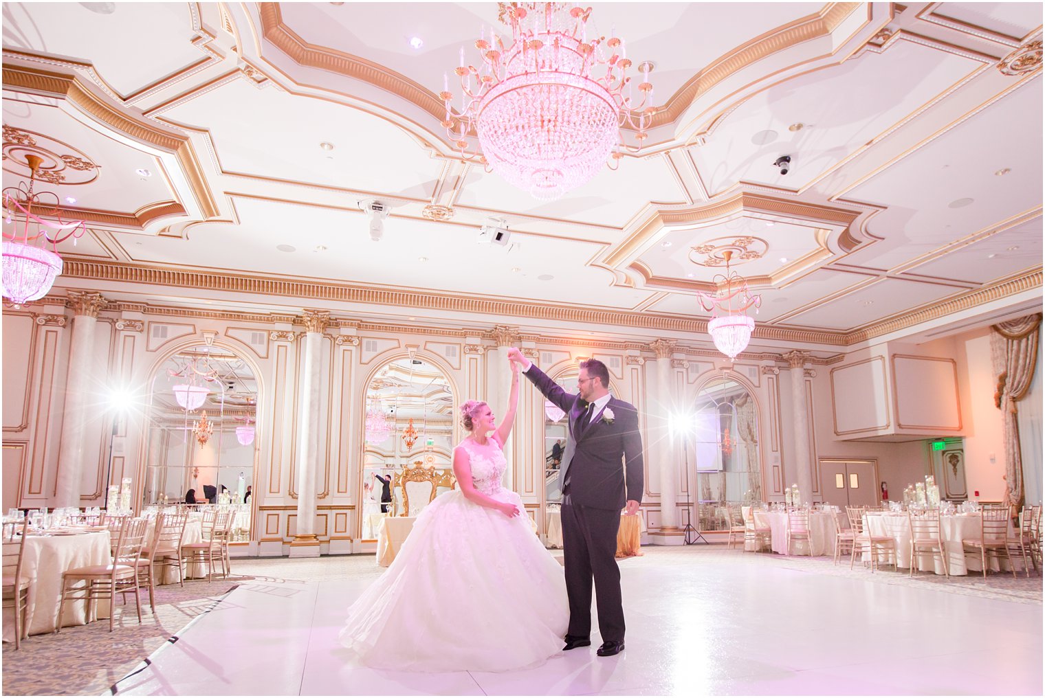 bride and groom dance in reception hall at Legacy Castle by Idalia Photography