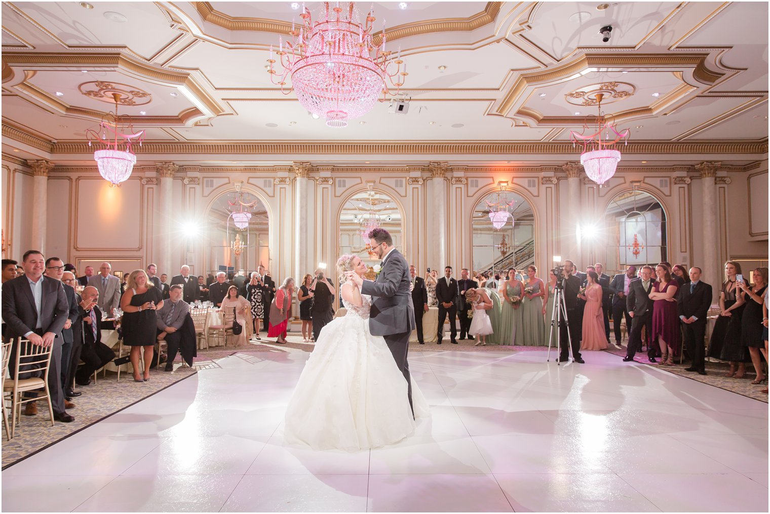 bride and groom dance during reception at Legacy Castle by Idalia Photography