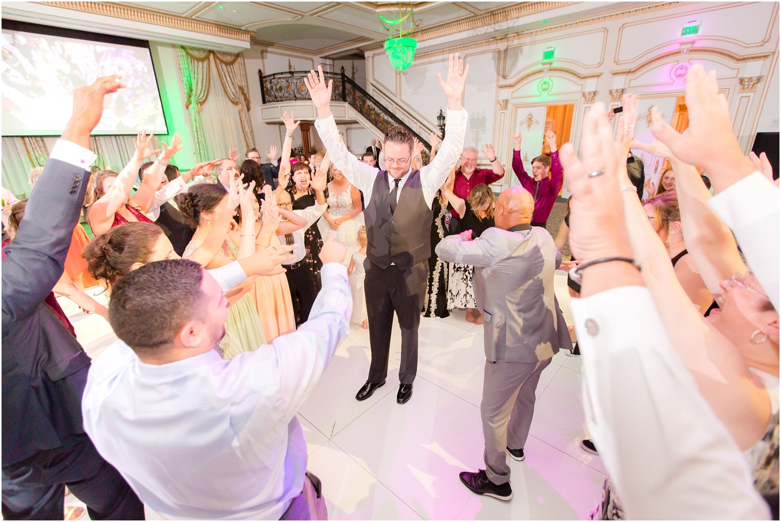 groom dances during reception at North Jersey wedding venue Legacy Castle