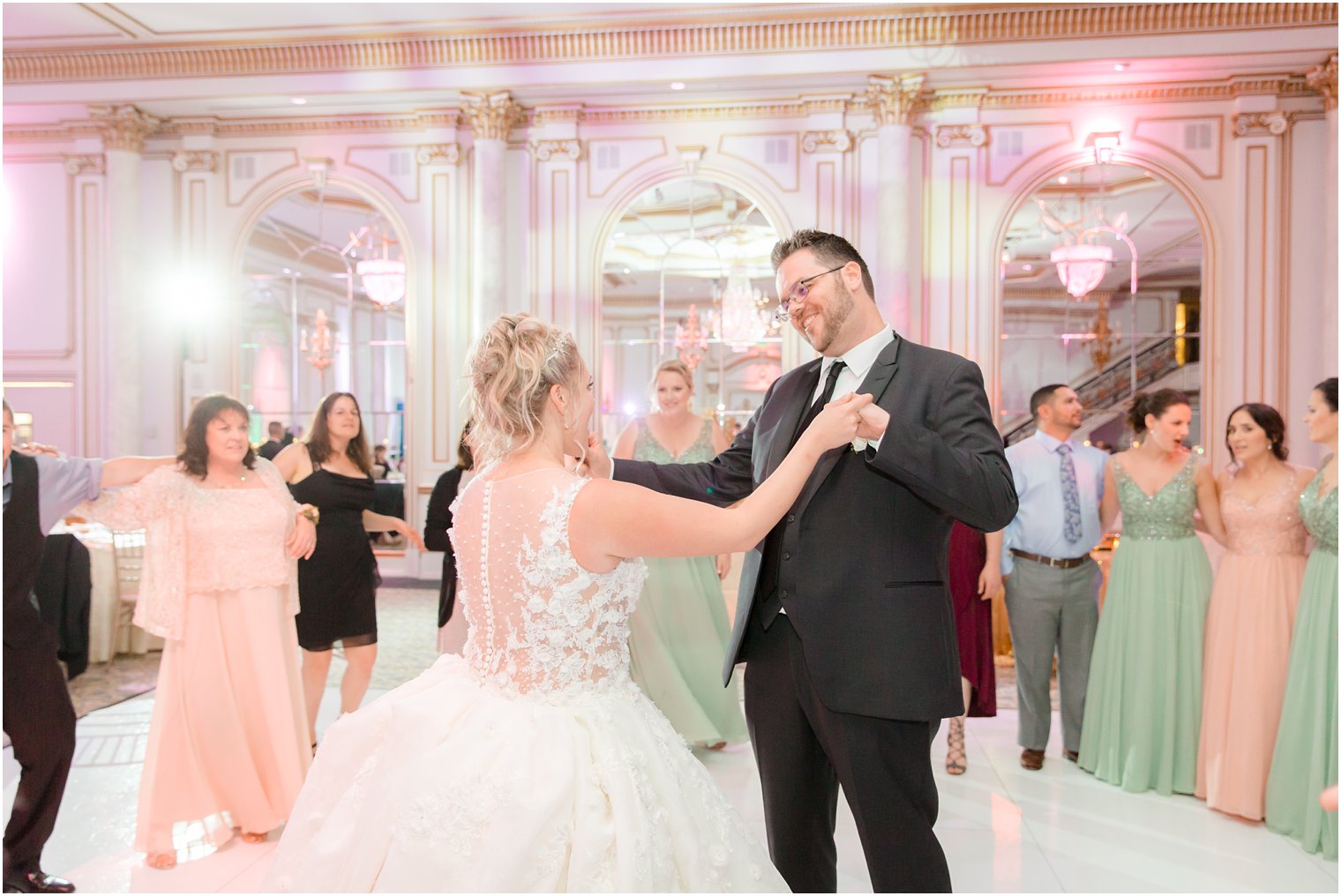 bride and groom dance during Legacy Castle reception by Idalia Photography