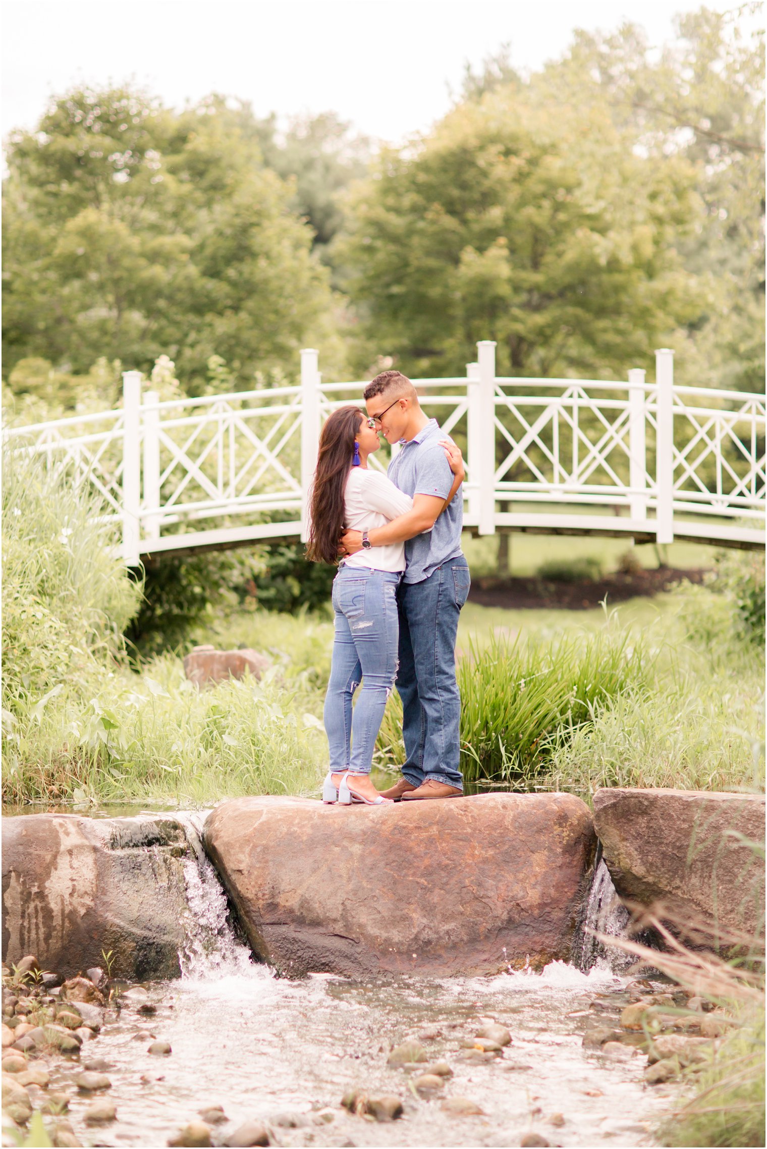 Sayen Gardens engagement session on bridge photographed by Idalia Photography