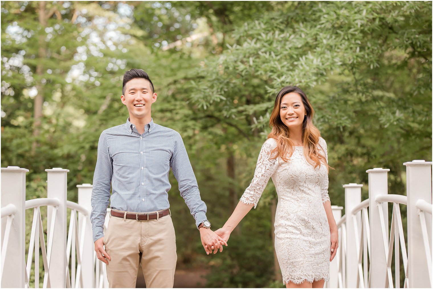 bride and groom hold hands during engagement session at Sayen House and Gardens 