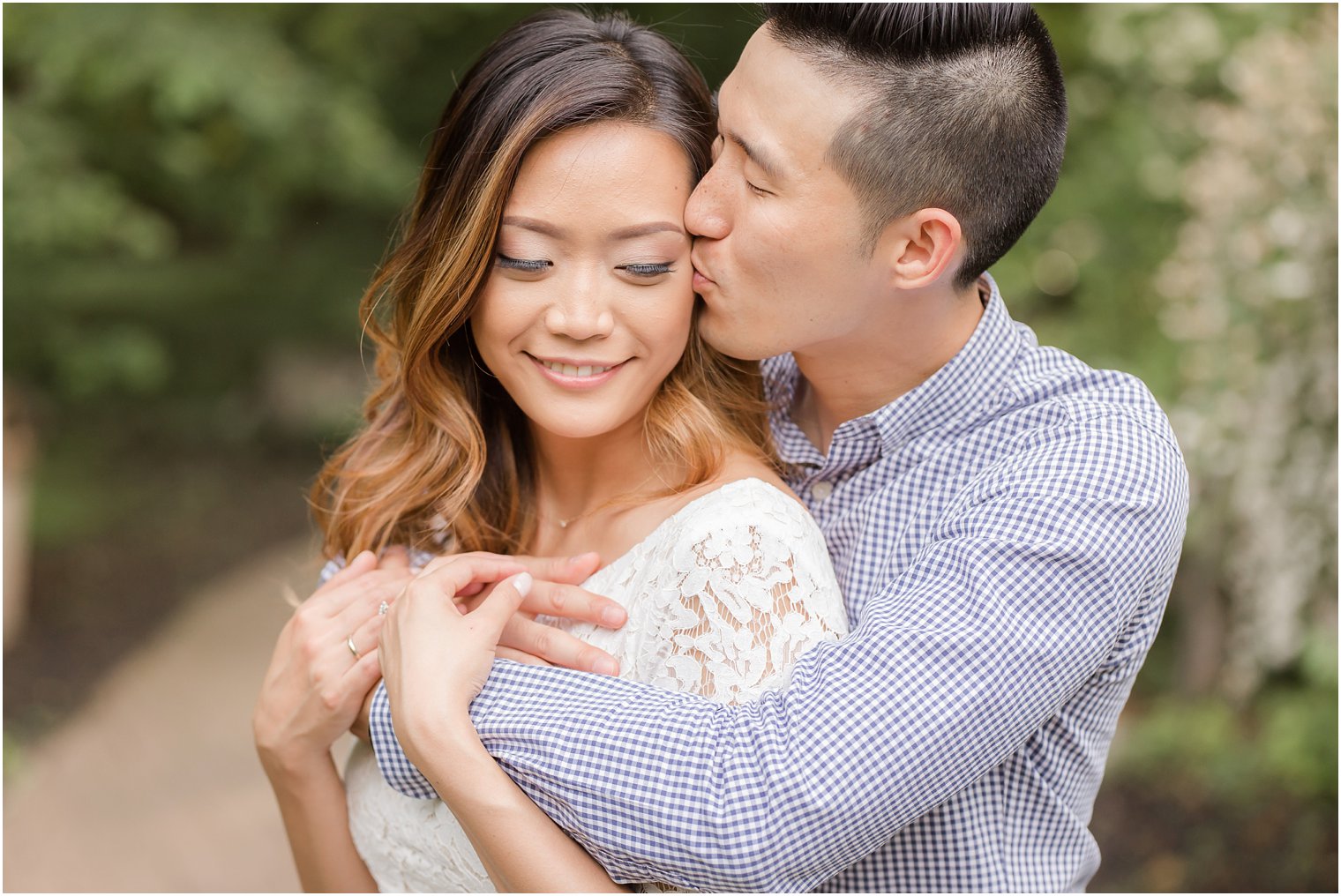 groom kisses bride during engagement session at Sayen House and Gardens with Idalia Photography associate photographer Jocelyn