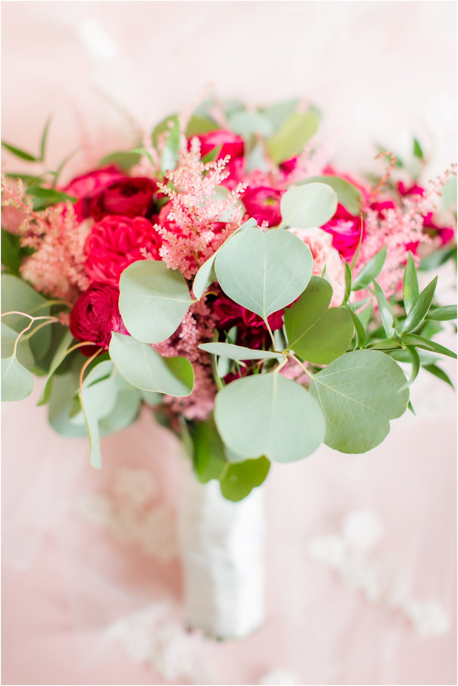 wedding bouquet with summer berry roses and greenery