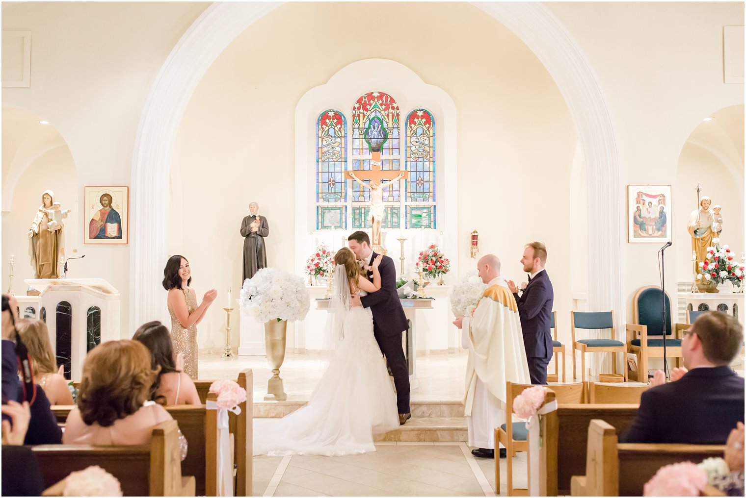 First kiss photo of bride and groom 