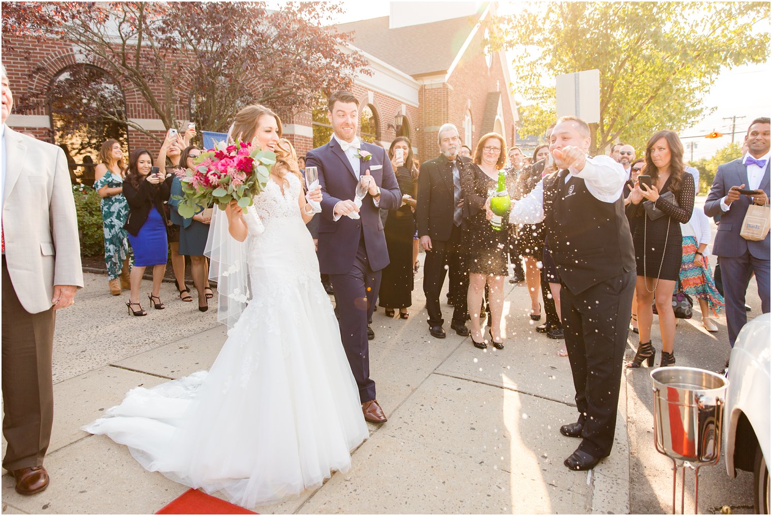 Popping champagne after ceremony