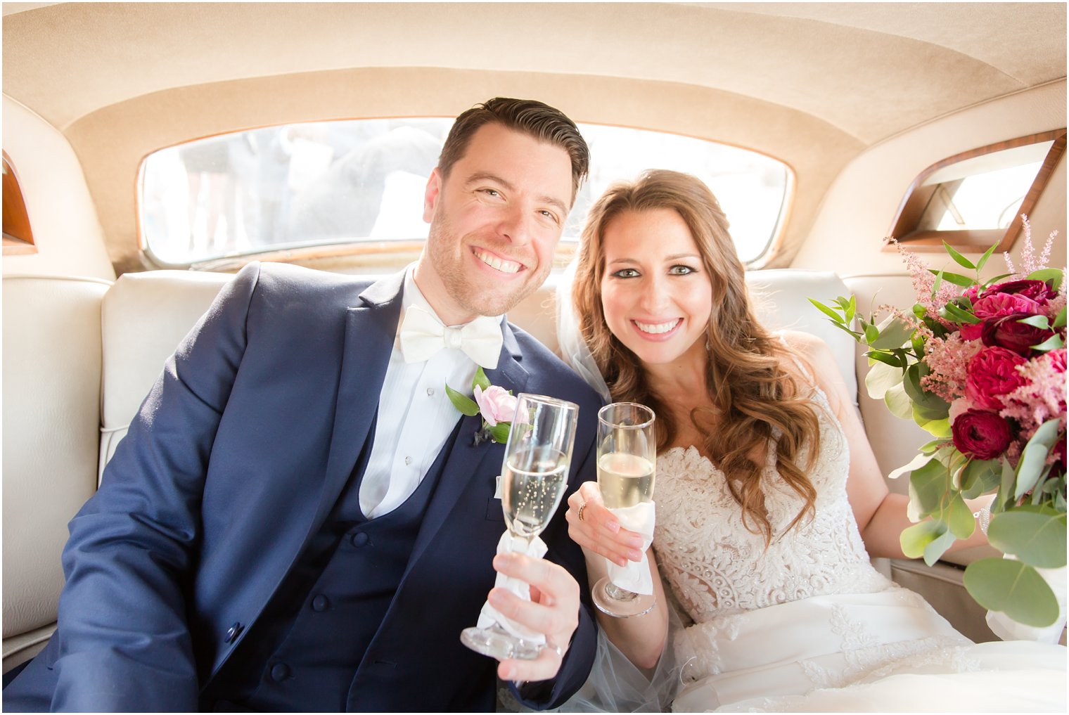 bride and groom in Rolls Royce