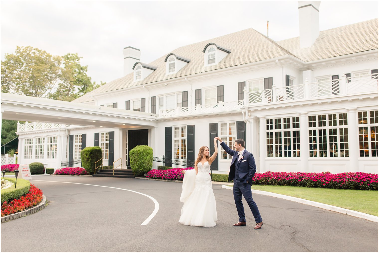 groom twirling his bride on wedding day at Shadowbrook