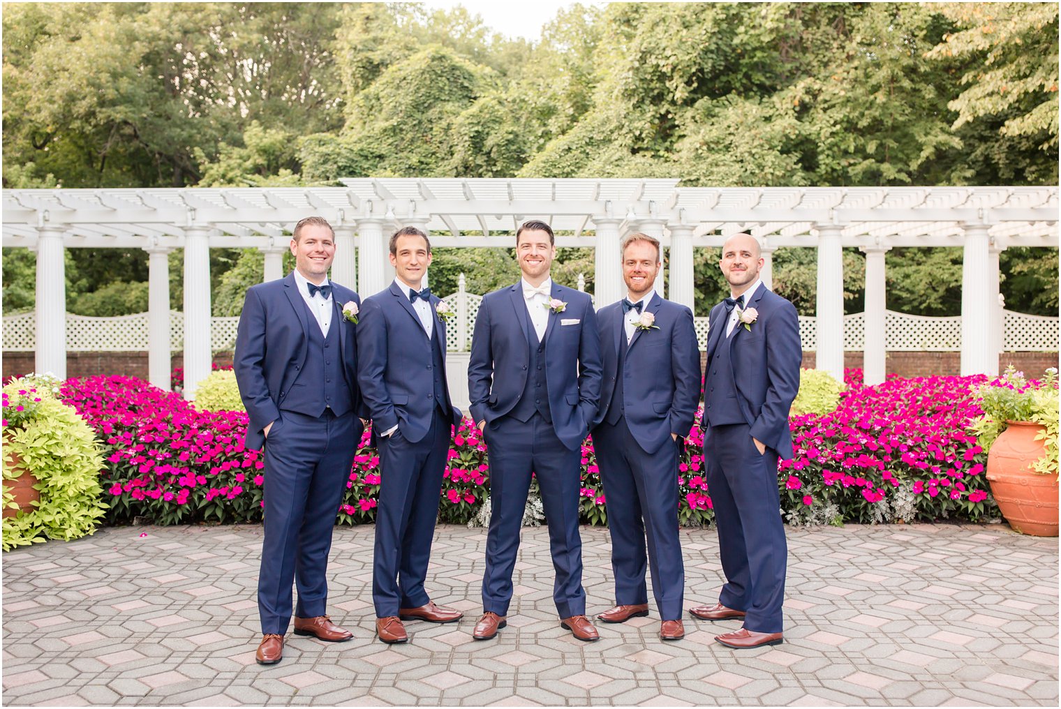 handsome groomsmen in navy suits