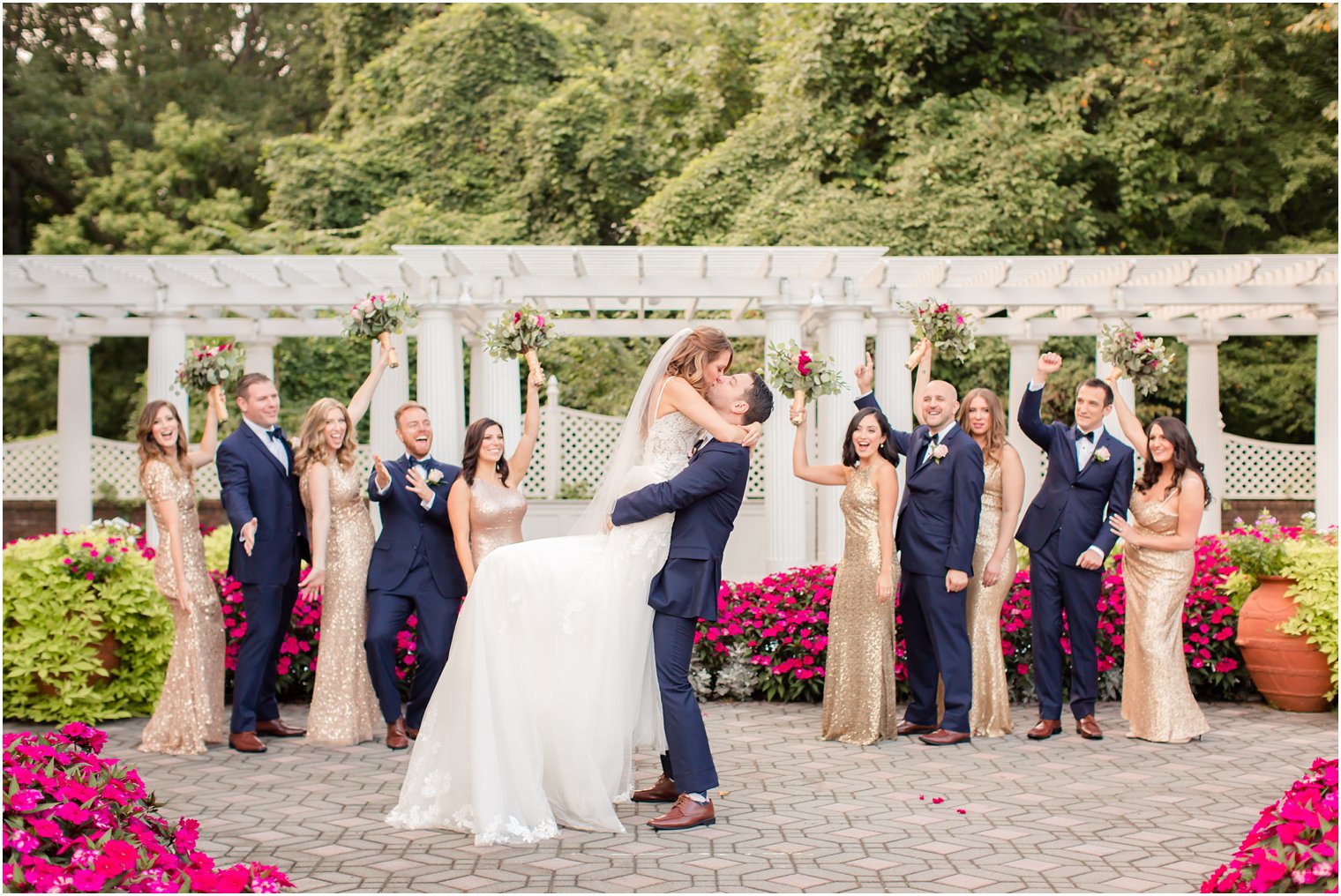 bridal party cheering on the bride and groom on their wedding day