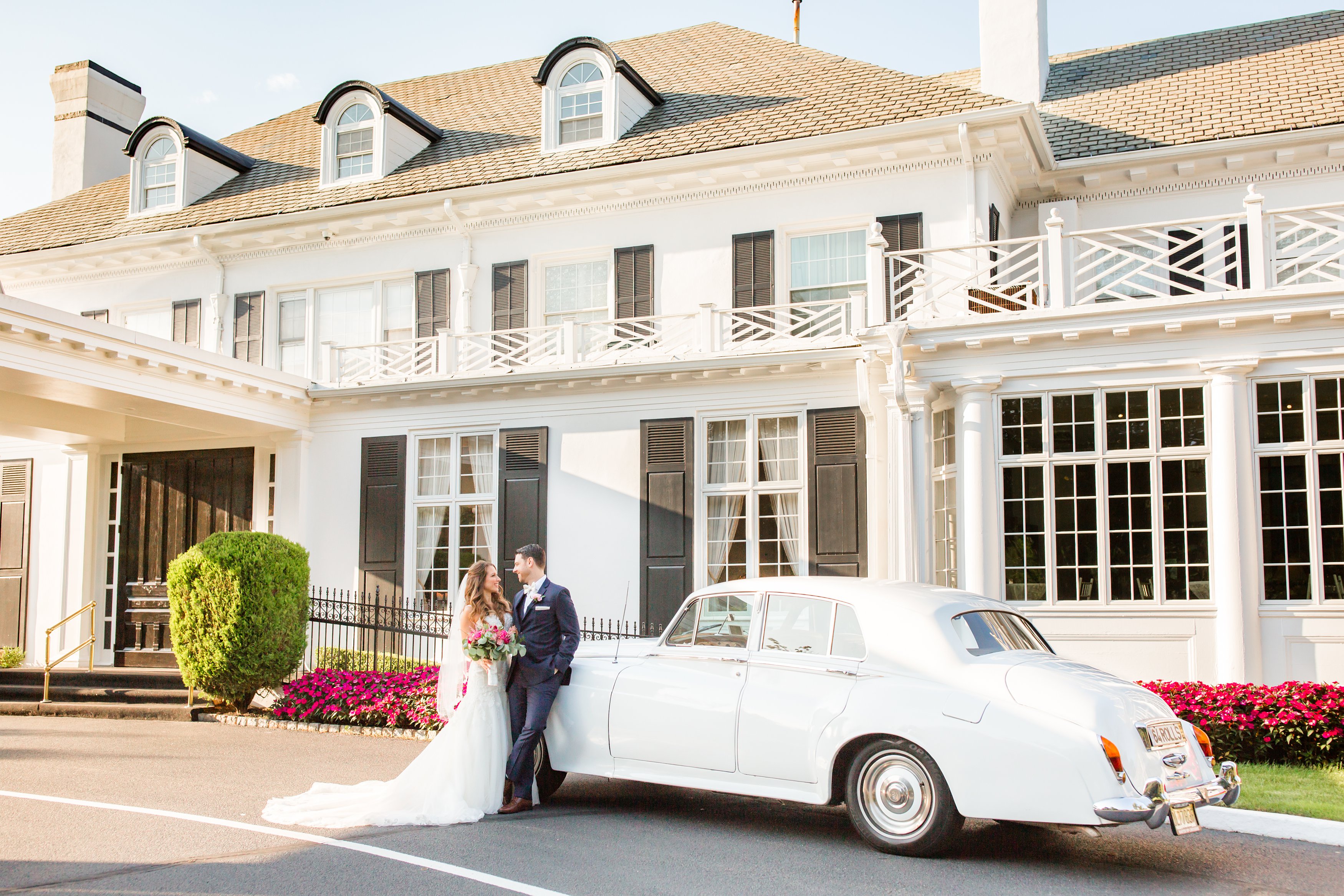 Couple posing with classic car at Shadowbrook