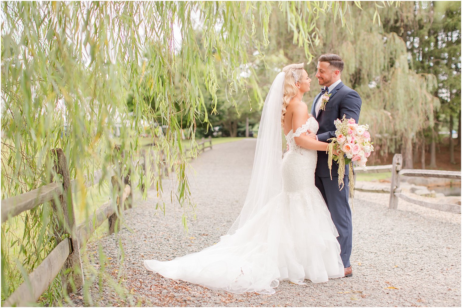 classic wedding portrait with weeping willow at Windows on the Water at Frogbridge