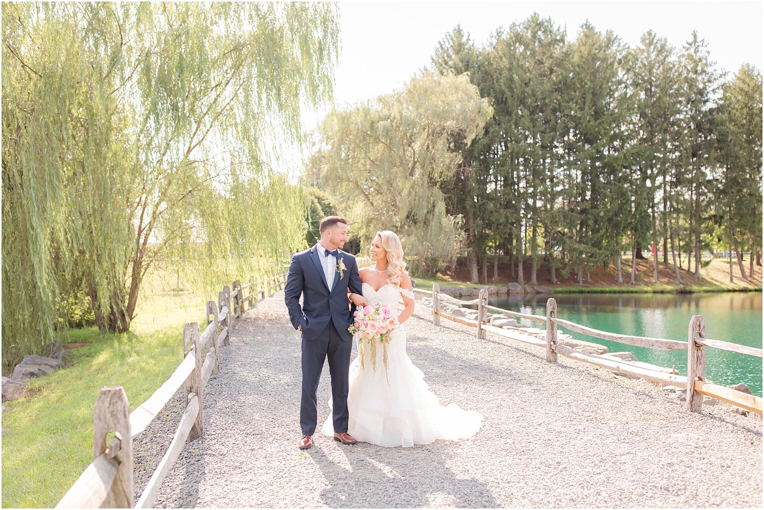 summer wedding portrait by pond at Windows on the Water at Frogbridge