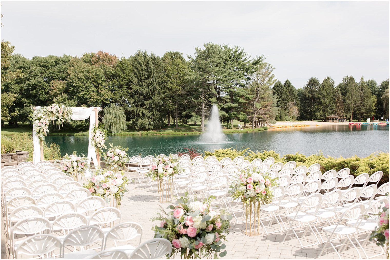 outdoor waterfront wedding ceremony at Windows on the Water at Frogbridge