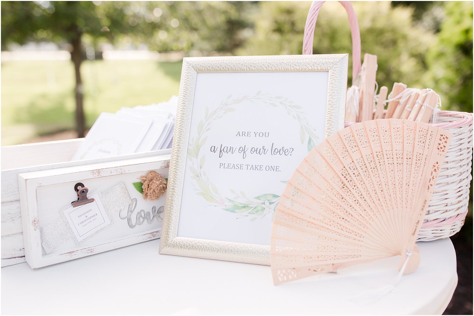 fans for wedding guests at Windows on the Water at Frogbridge outdoor wedding ceremony