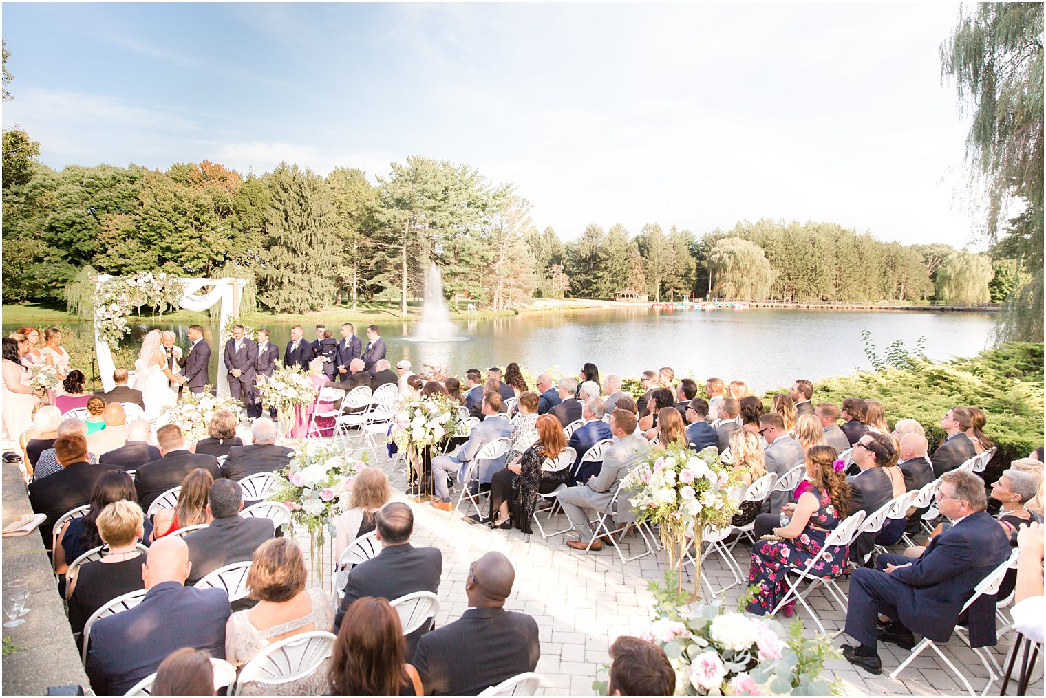 outdoor summer wedding ceremony at Windows on the Water at Frogbridge photographed by Idalia Photography
