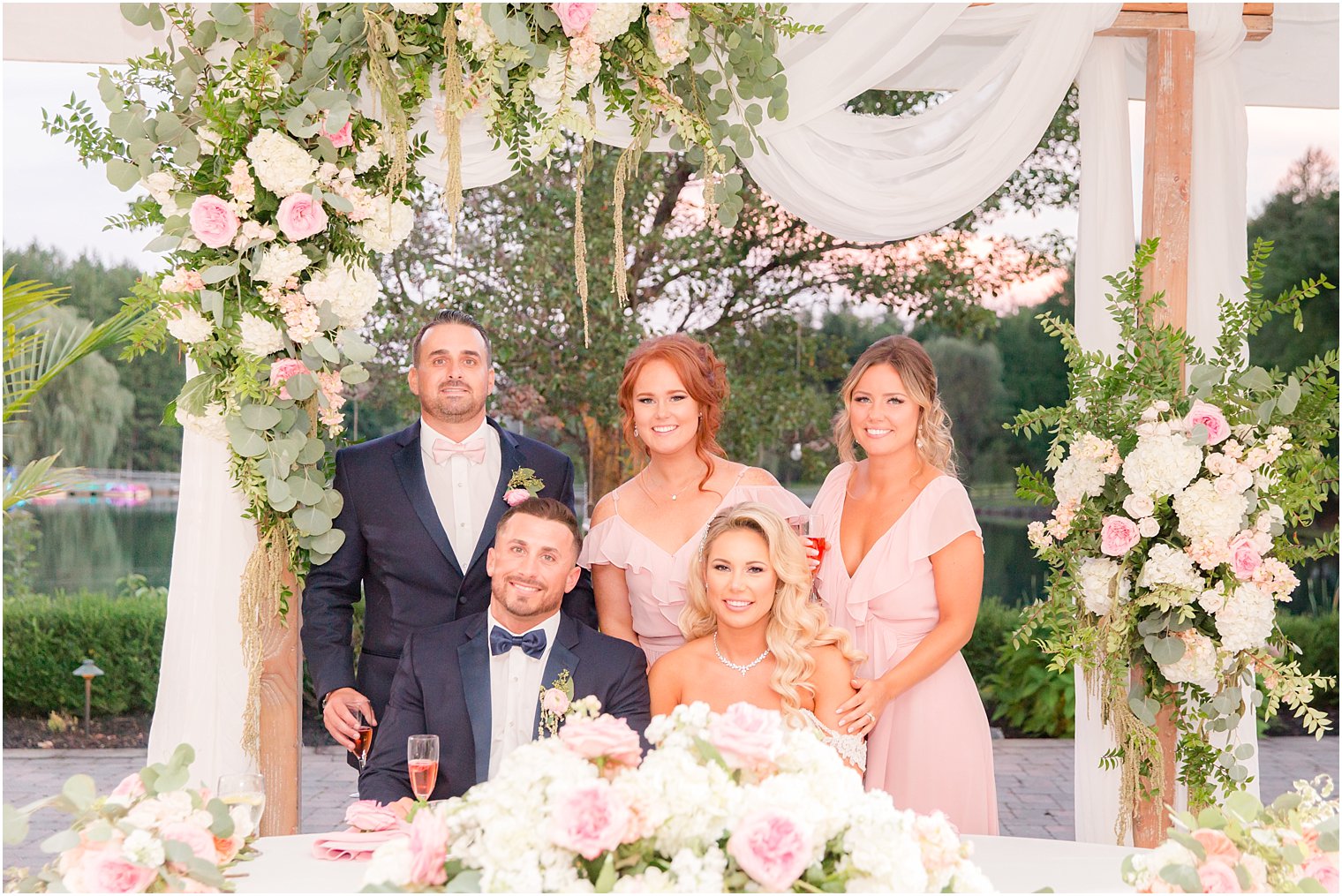 bride and groom with best man and bridesmaids at Windows on the Water at Frogbridge