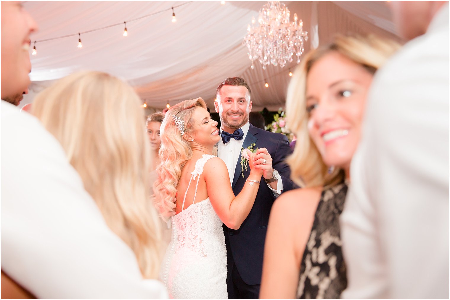 bride and groom dance during tented reception at Windows on the Water at Frogbridge