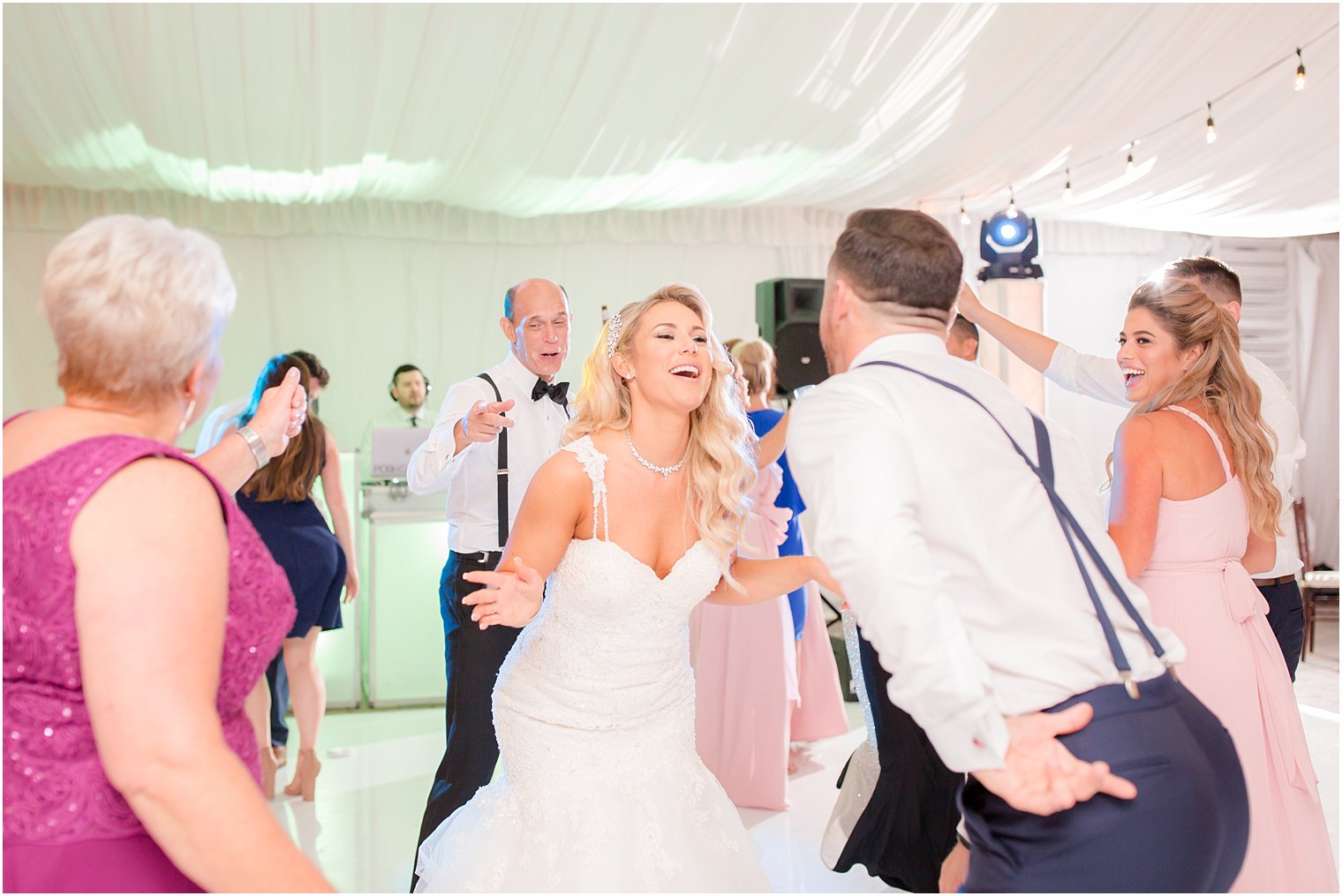 bride and groom having fun during reception at Windows on the Water at Frogbridge