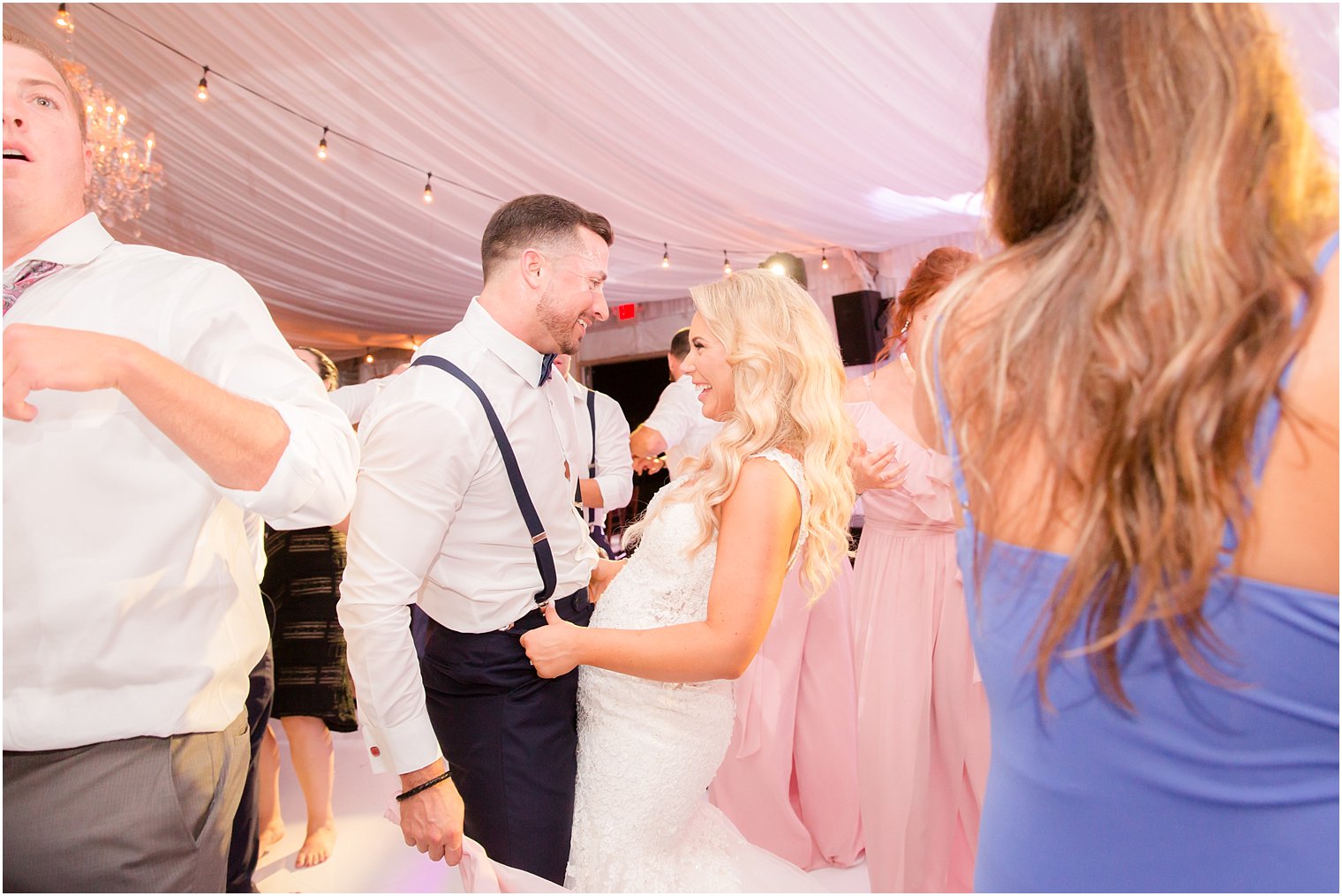 bride and groom dance during reception at Windows on the Water at Frogbridge