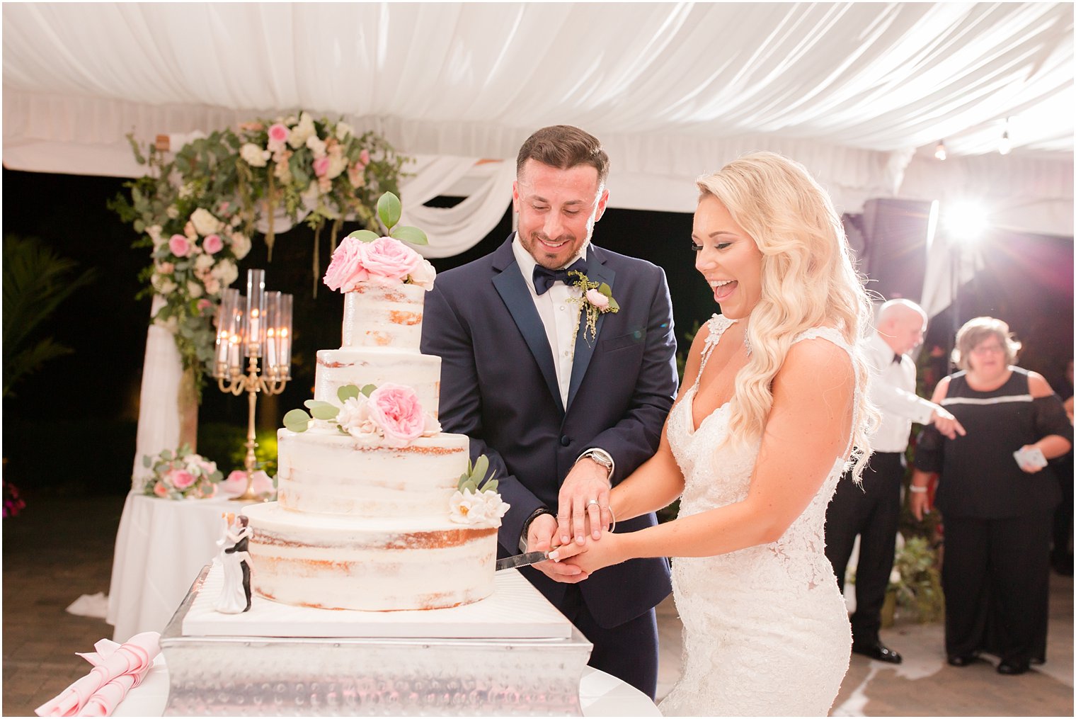 bride and groom cut cake by Palermo's Bakery during reception at Windows on the Water at Frogbridge