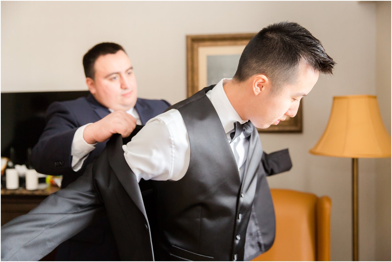 Groom getting ready with best man 