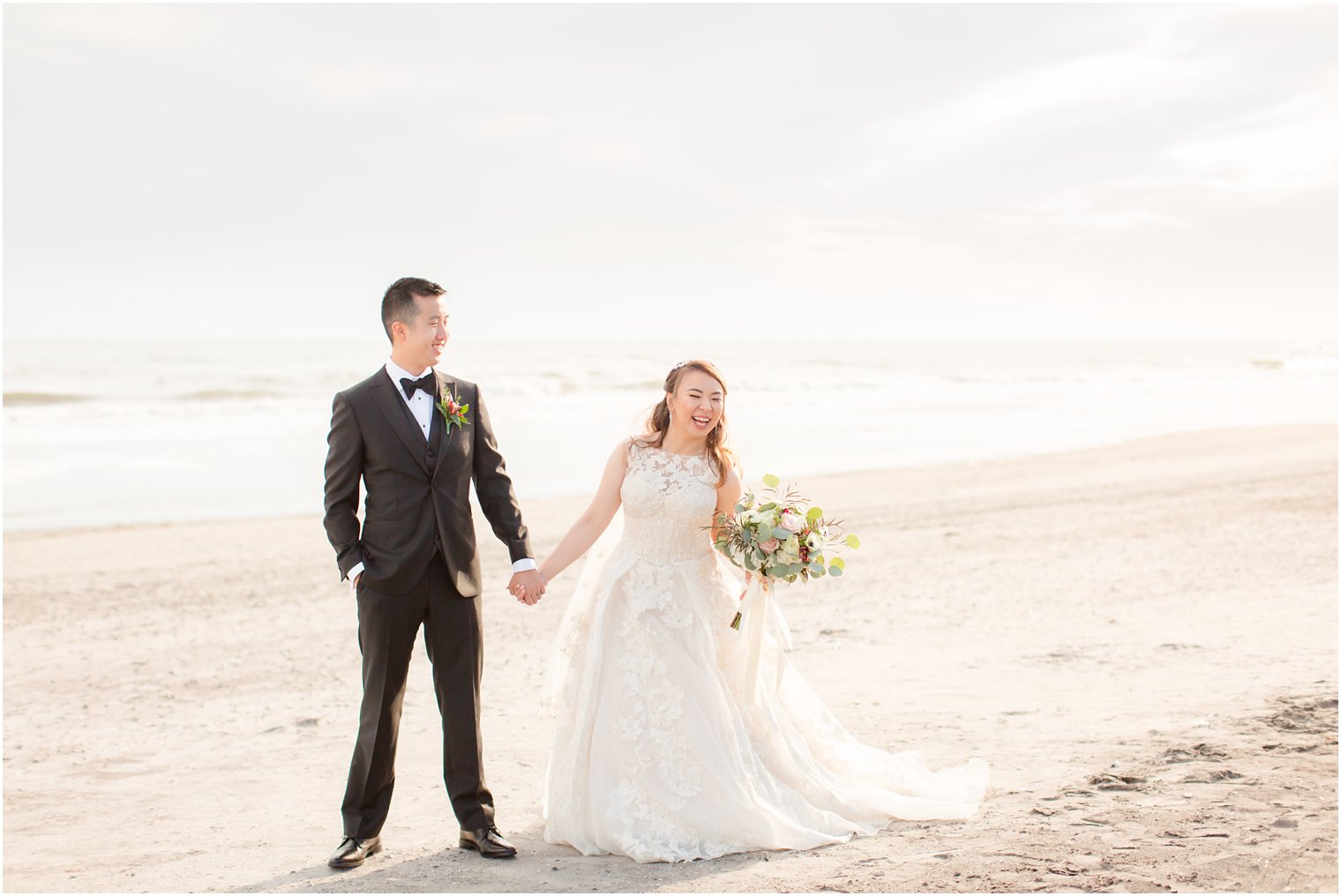 Joyful bride with groom on Atlantic City beach