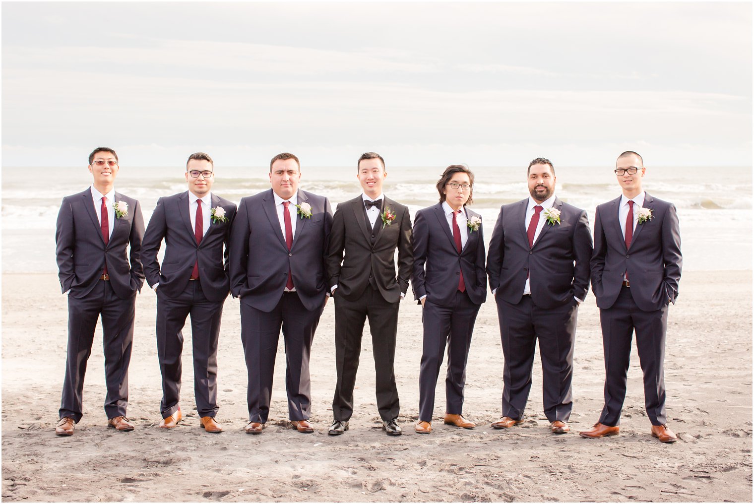 Groomsmen wearing navy and burgundy