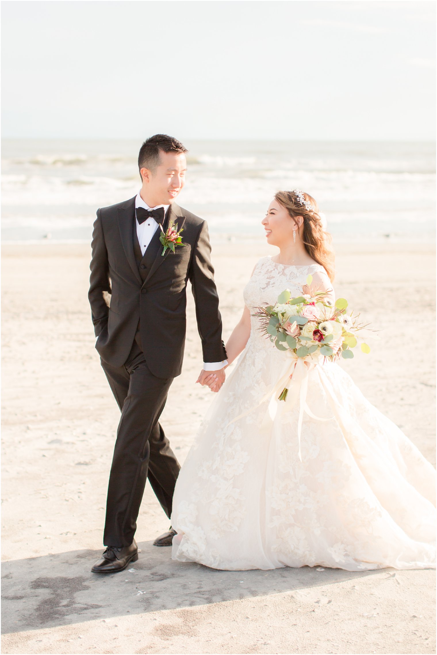 Bride and groom during portrait session on the beach 