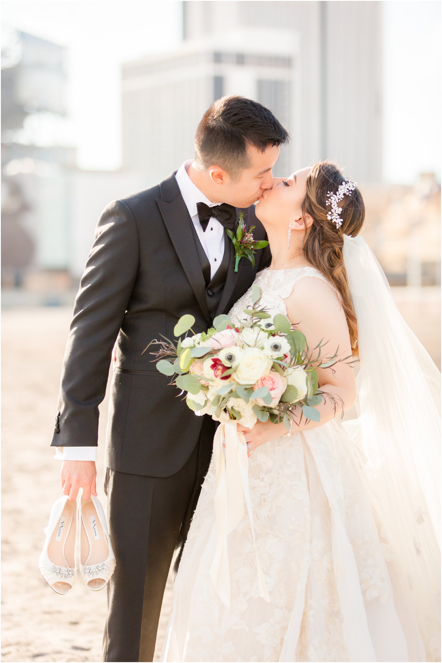 Wedding portrait of couple on the beach in Atlantic City, NJ