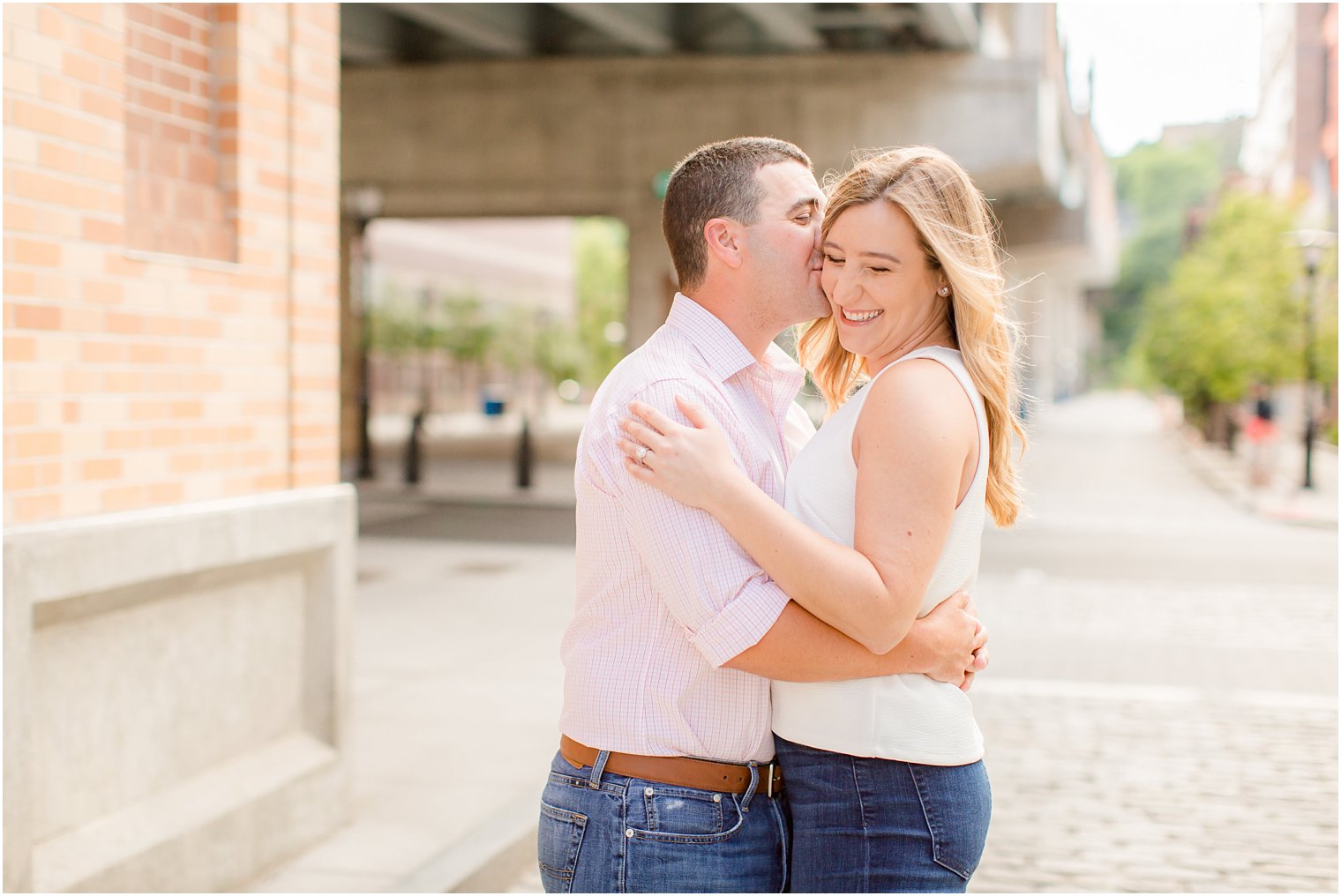 happy couple during Hoboken NJ engagement portraits with Idalia Photography