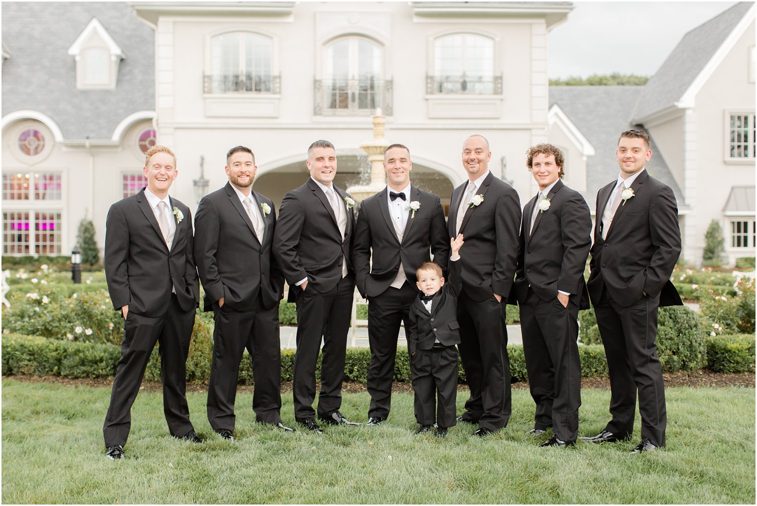 Photo of groom, groomsmen, and ring bearer at Park Chateau Estate