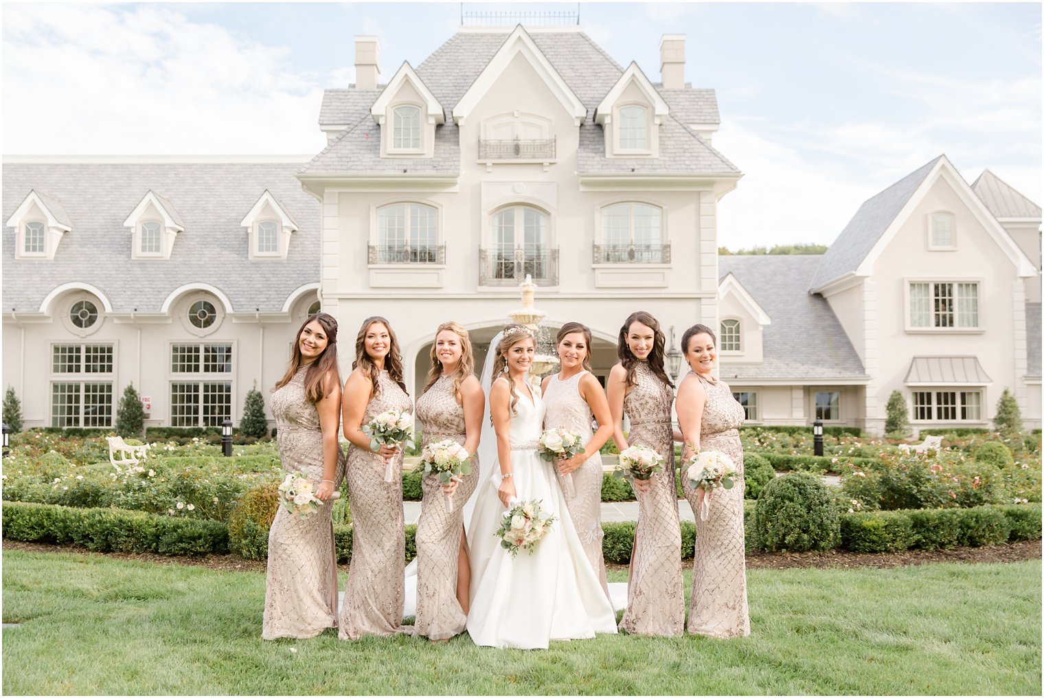 Group photo of bridesmaids in front of NJ wedding venue by Idalia Photography