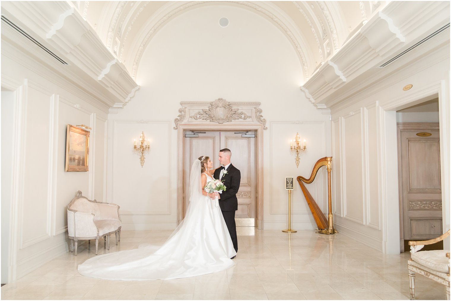 Elegant bride and groom photos during indoor wedding reception