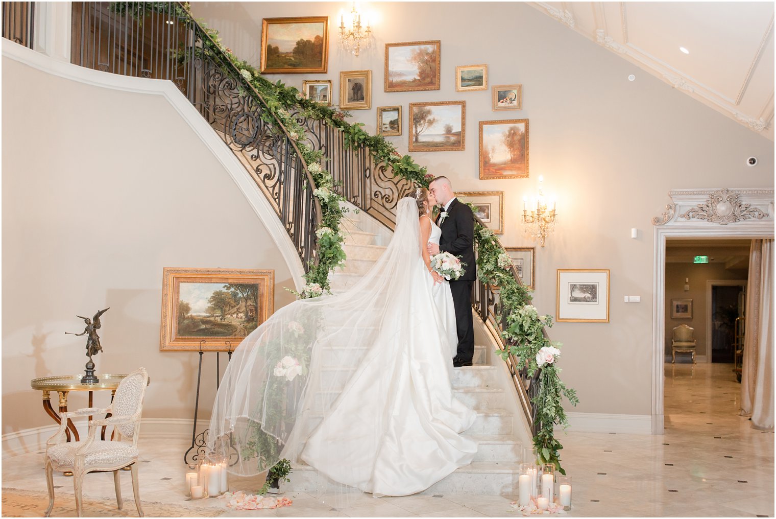 Elegant bride and groom portrait with veil toss