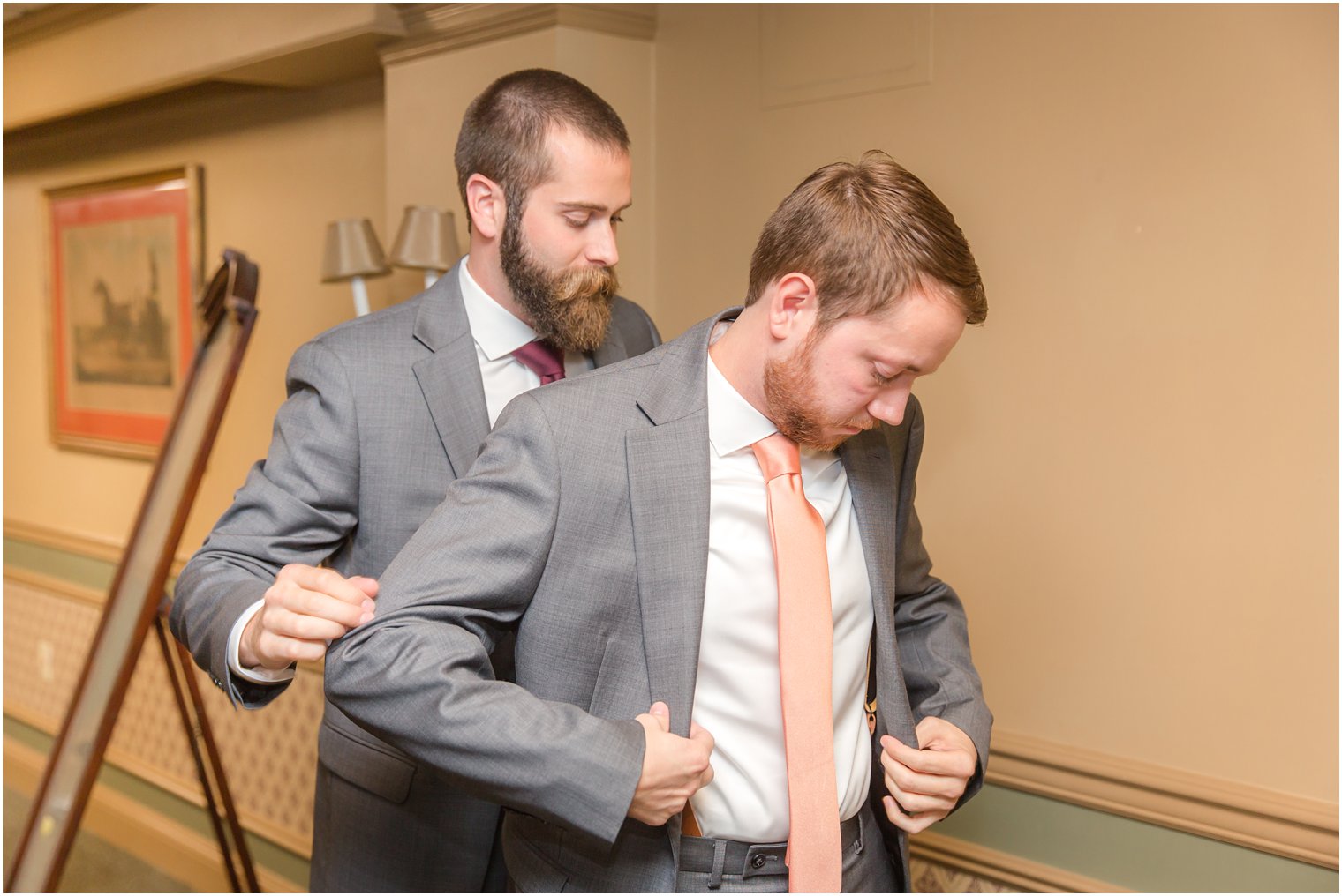 groom and groomsman prepare for Cross Estate Gardens Wedding day by Idalia Photography