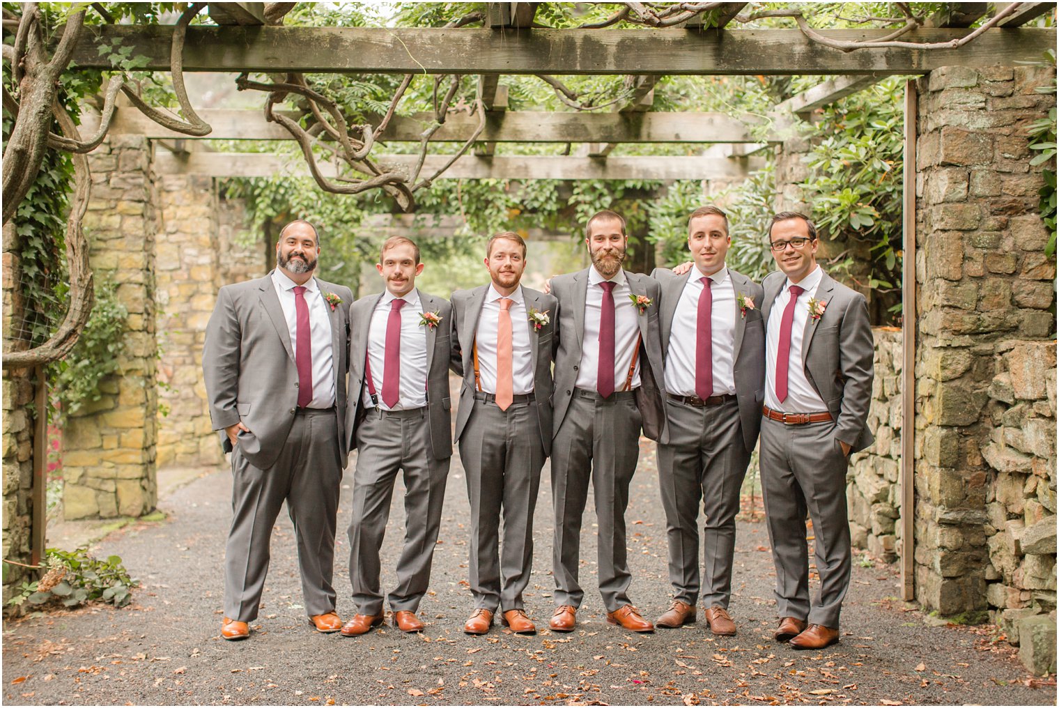 groom and groomsmen during Olde Mill Inn wedding day photographed by Idalia Photography