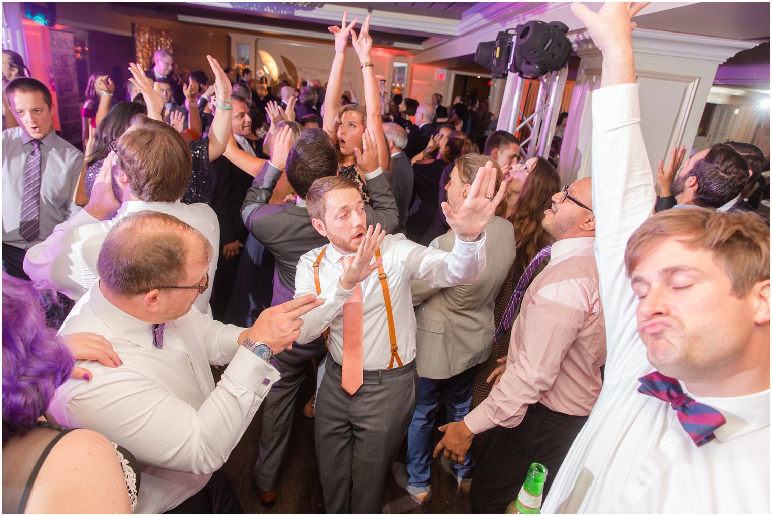 groom dances during wedding reception at New Jersey wedding venue Olde Mill Inn photographed by Idalia Photography